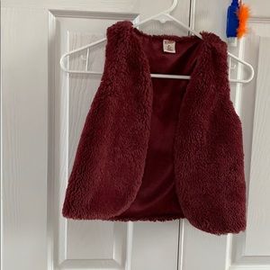 Maroon, furry vest